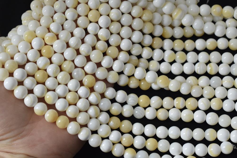 15.5" 10mm/12mm Natural half yellow shell round beads